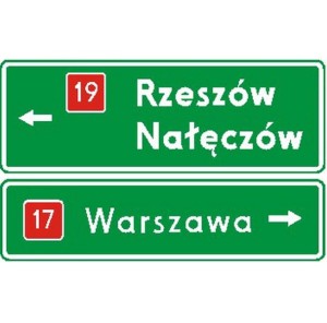 Znak E-2B - Drogowskaz tablicowy umieszczany nad jezdnią - Generacja II